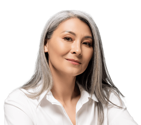 Small business owner with long grey hair and wearing a white blouse.